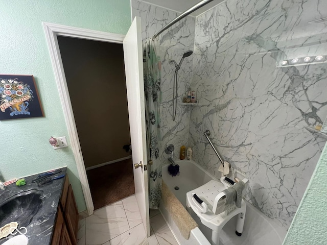 bathroom with vanity and tiled shower / bath