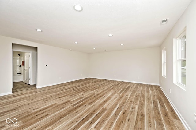 spare room featuring light hardwood / wood-style flooring