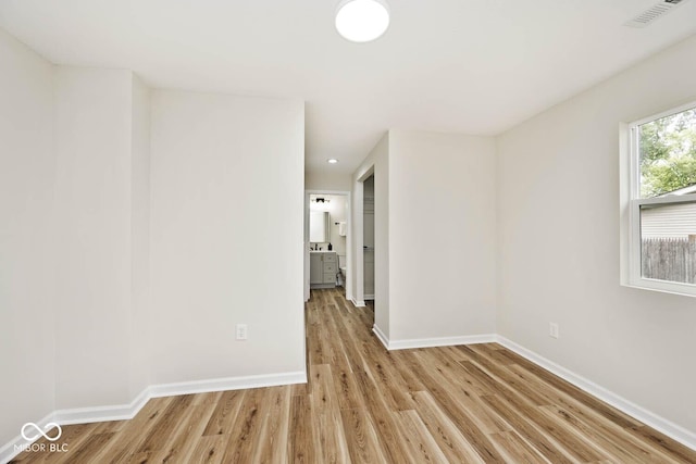 unfurnished room featuring light hardwood / wood-style floors