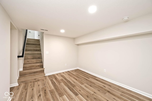 basement with wood-type flooring