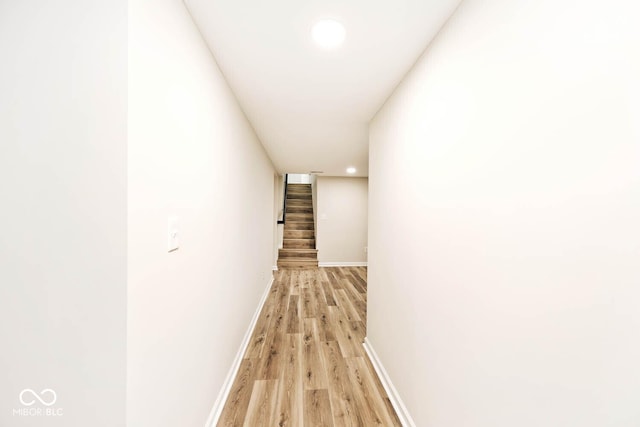 hall with light hardwood / wood-style flooring