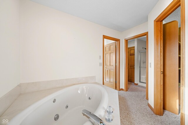 bathroom featuring separate shower and tub