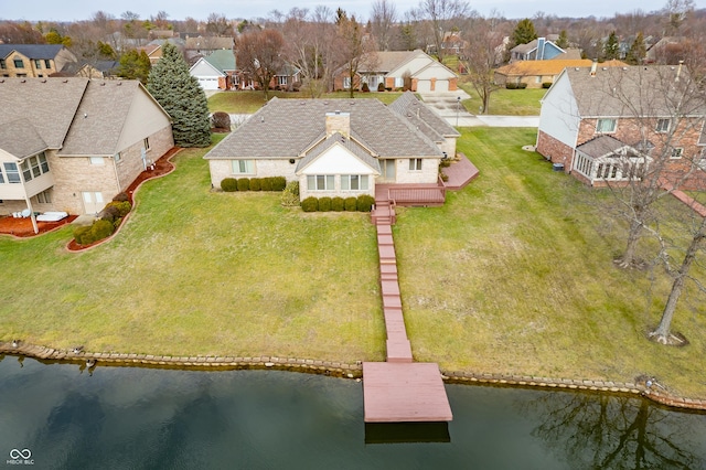 bird's eye view with a water view