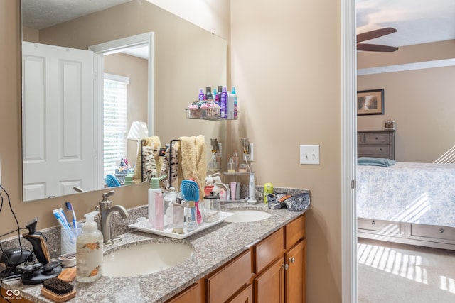 bathroom with ceiling fan and vanity