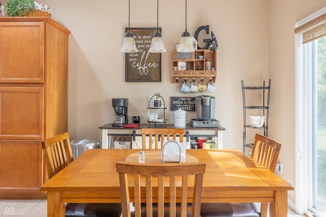 dining space featuring light tile patterned floors