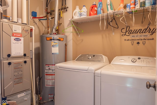 clothes washing area with washing machine and clothes dryer, heating unit, and water heater