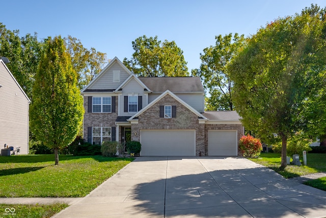 view of front of house featuring a garage and a front yard