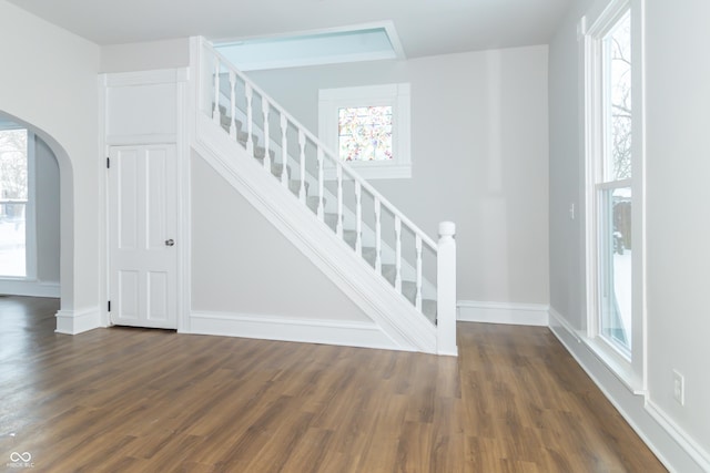 stairs with hardwood / wood-style flooring