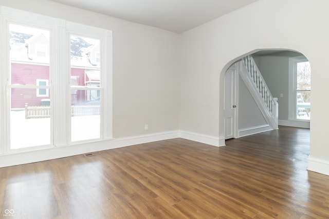 empty room featuring dark wood-type flooring