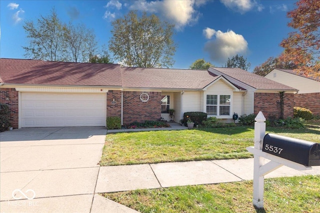 ranch-style home with a garage and a front lawn