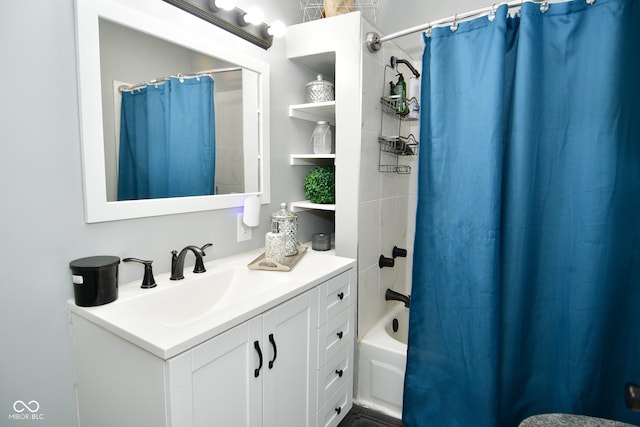 bathroom featuring shower / bath combo and vanity