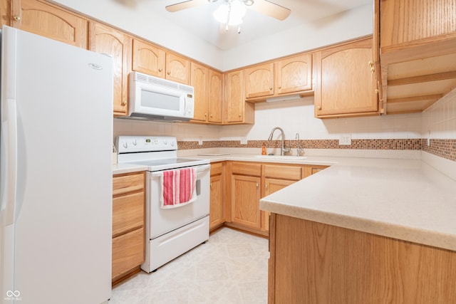 kitchen with ceiling fan, light brown cabinets, and white appliances