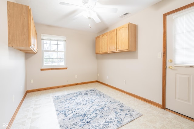 laundry area with ceiling fan