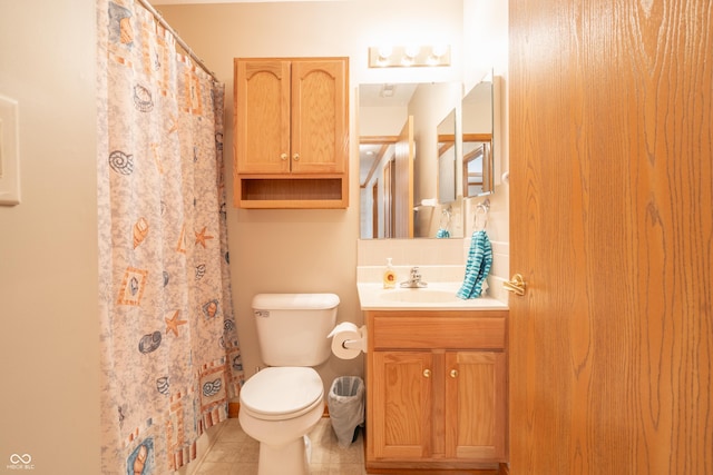 bathroom with tile patterned flooring, vanity, curtained shower, and toilet