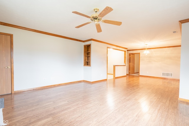 unfurnished room with wood-type flooring, ceiling fan with notable chandelier, and ornamental molding