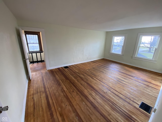 unfurnished room featuring dark hardwood / wood-style floors