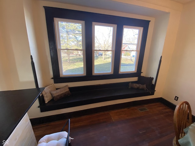 sitting room featuring dark wood-type flooring