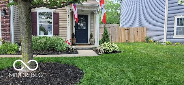 property entrance with a yard