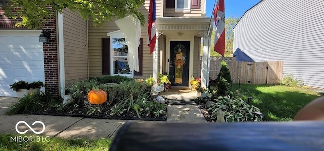 view of exterior entry featuring a garage