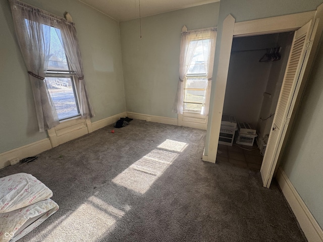 unfurnished bedroom with carpet floors