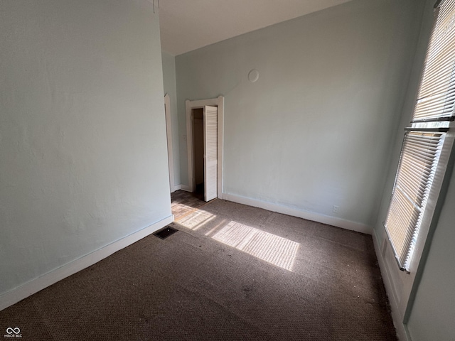 empty room featuring carpet flooring