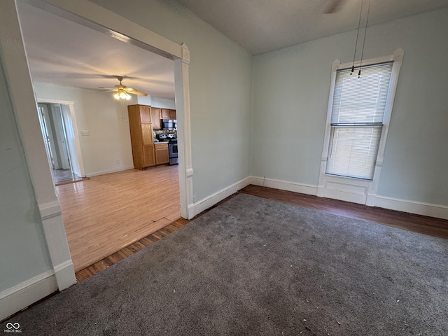 unfurnished room featuring ceiling fan and light wood-type flooring