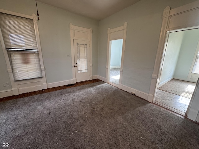 view of carpeted foyer entrance