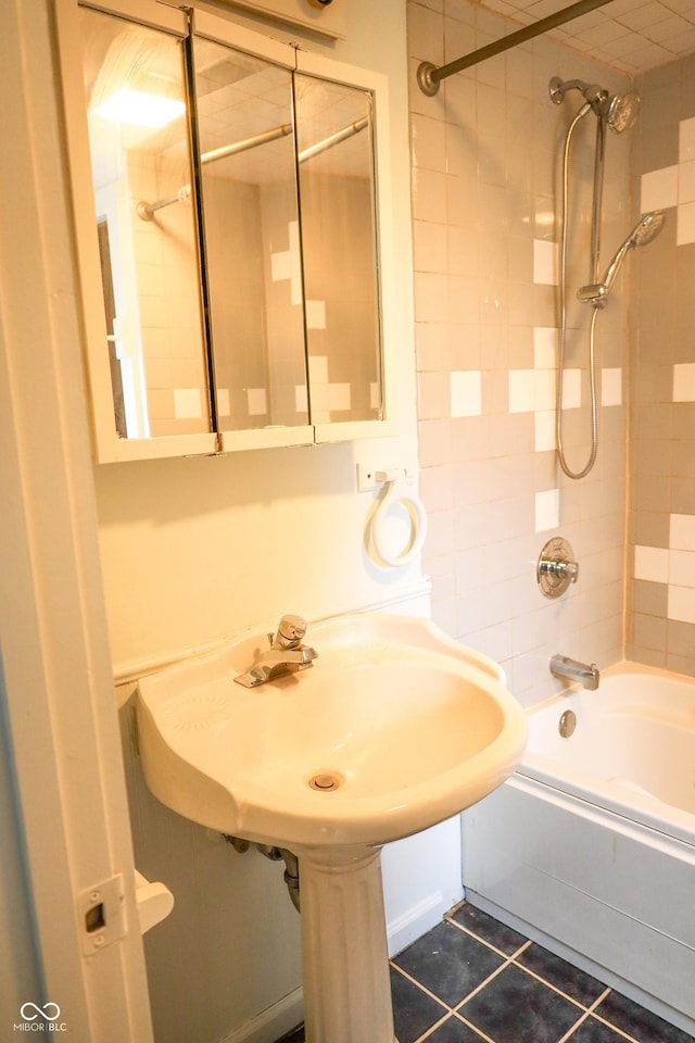 bathroom featuring tile patterned floors and tiled shower / bath