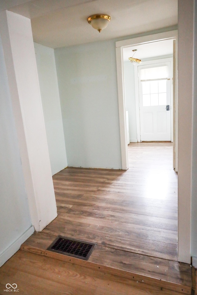 hallway featuring hardwood / wood-style flooring