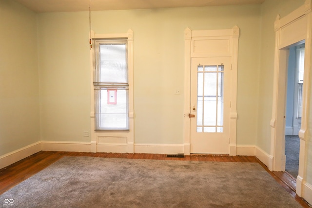 unfurnished room featuring hardwood / wood-style flooring