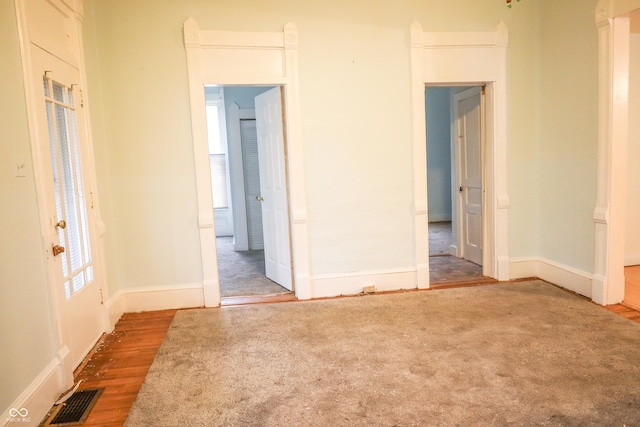 spare room with hardwood / wood-style floors