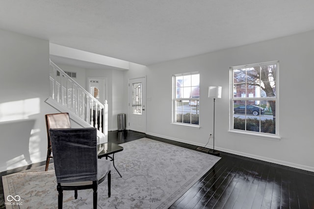 entryway featuring dark wood-type flooring