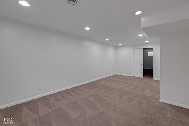 spare room with light colored carpet