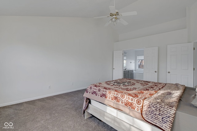 carpeted bedroom with ensuite bath, ceiling fan, and lofted ceiling