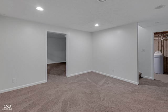 spare room featuring light colored carpet