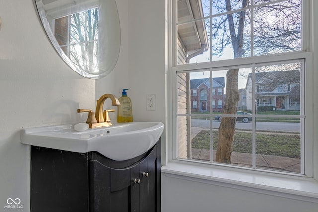 bathroom featuring plenty of natural light and vanity