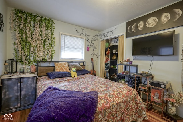 bedroom featuring wood-type flooring