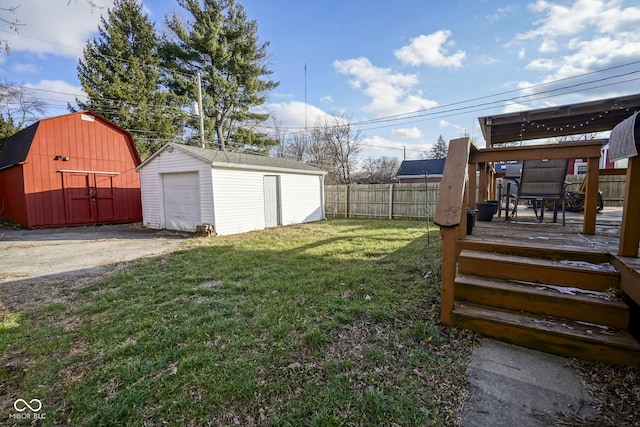 view of yard featuring an outbuilding and a wooden deck