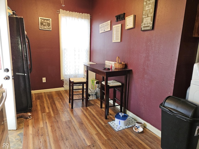 home office with hardwood / wood-style floors