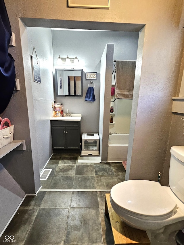 full bathroom featuring vanity, toilet, and shower / bath combination