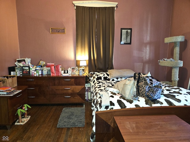 bedroom featuring dark hardwood / wood-style flooring