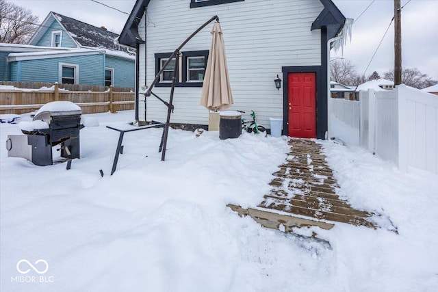 view of snow covered house