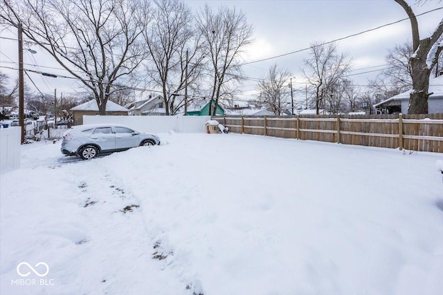 view of yard covered in snow