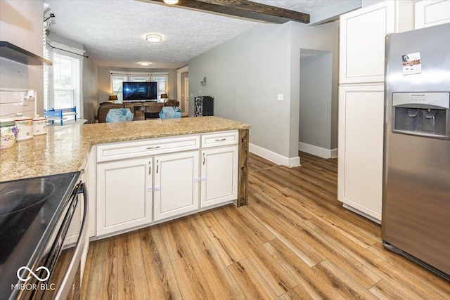 kitchen with a textured ceiling, kitchen peninsula, black electric range, and stainless steel refrigerator with ice dispenser