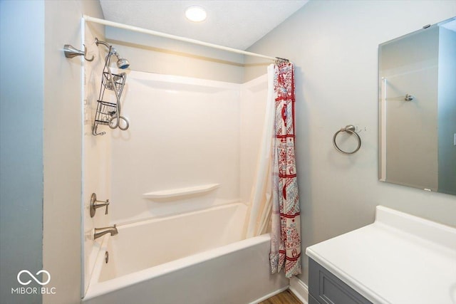 bathroom with shower / bath combo and vanity