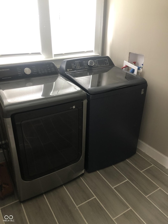 clothes washing area featuring washing machine and clothes dryer