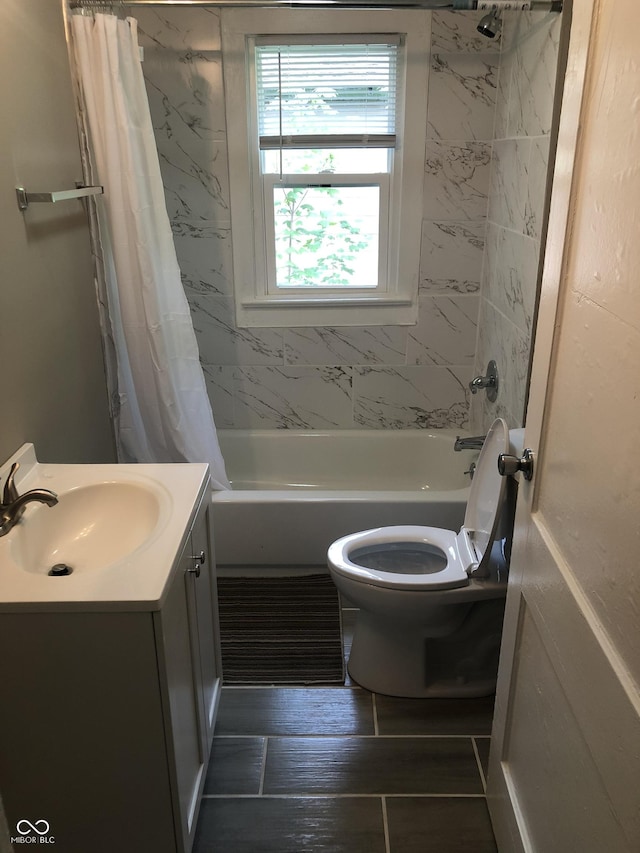 full bathroom with shower / bath combo with shower curtain, vanity, hardwood / wood-style floors, and toilet