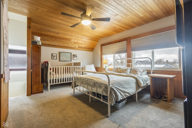 carpeted bedroom with ceiling fan, wood ceiling, and lofted ceiling