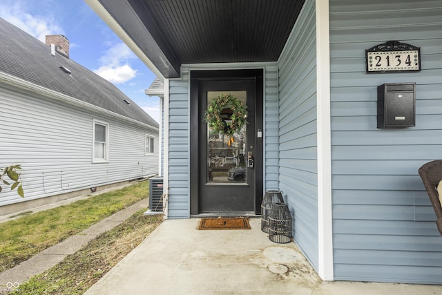 view of exterior entry featuring central AC