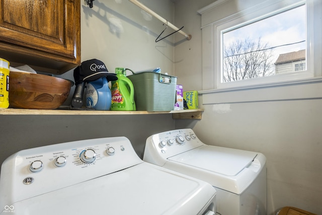 laundry area featuring cabinets and separate washer and dryer